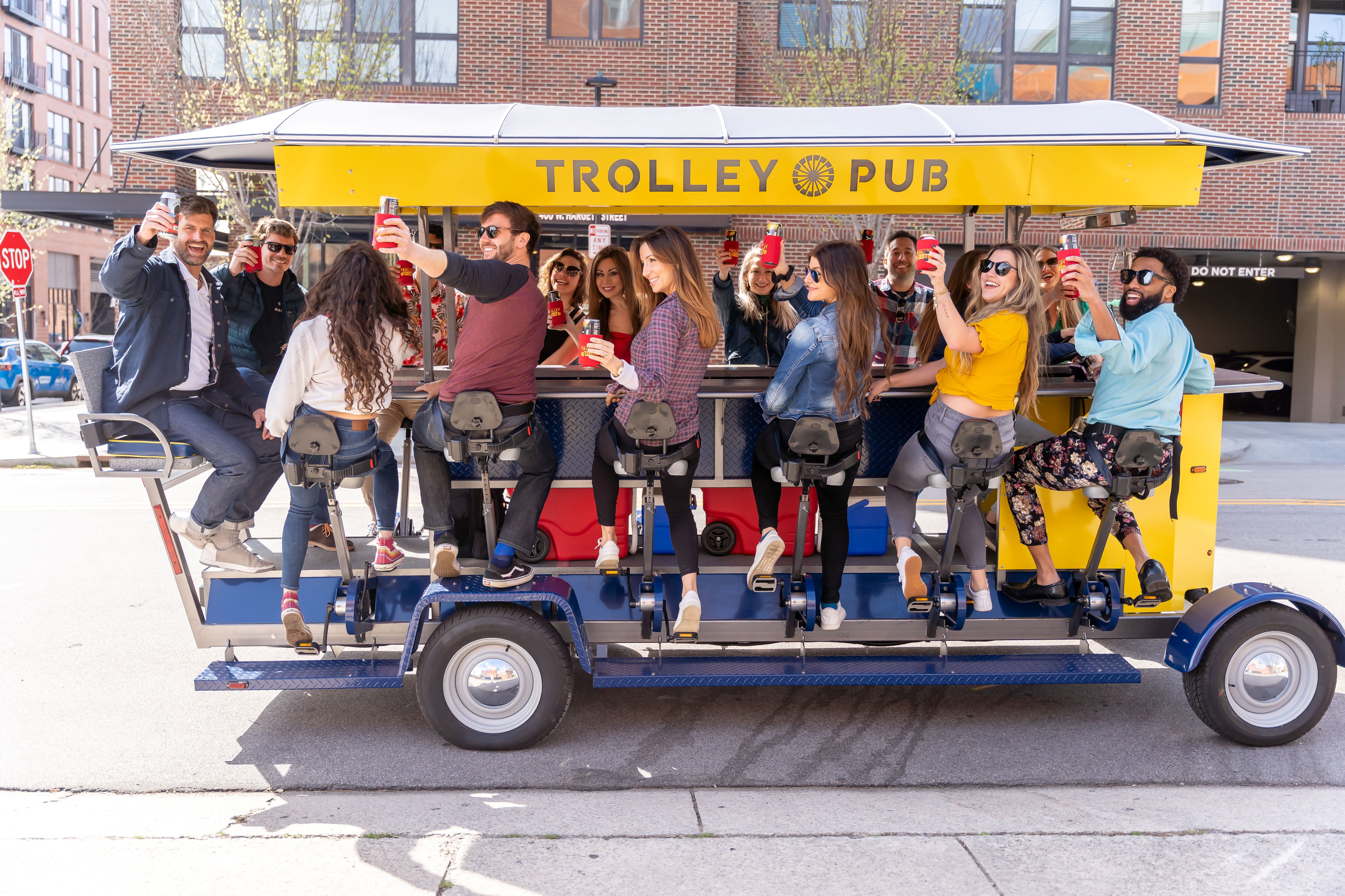 Group of riders enjoying a Trolley Pub party bike tour downtown