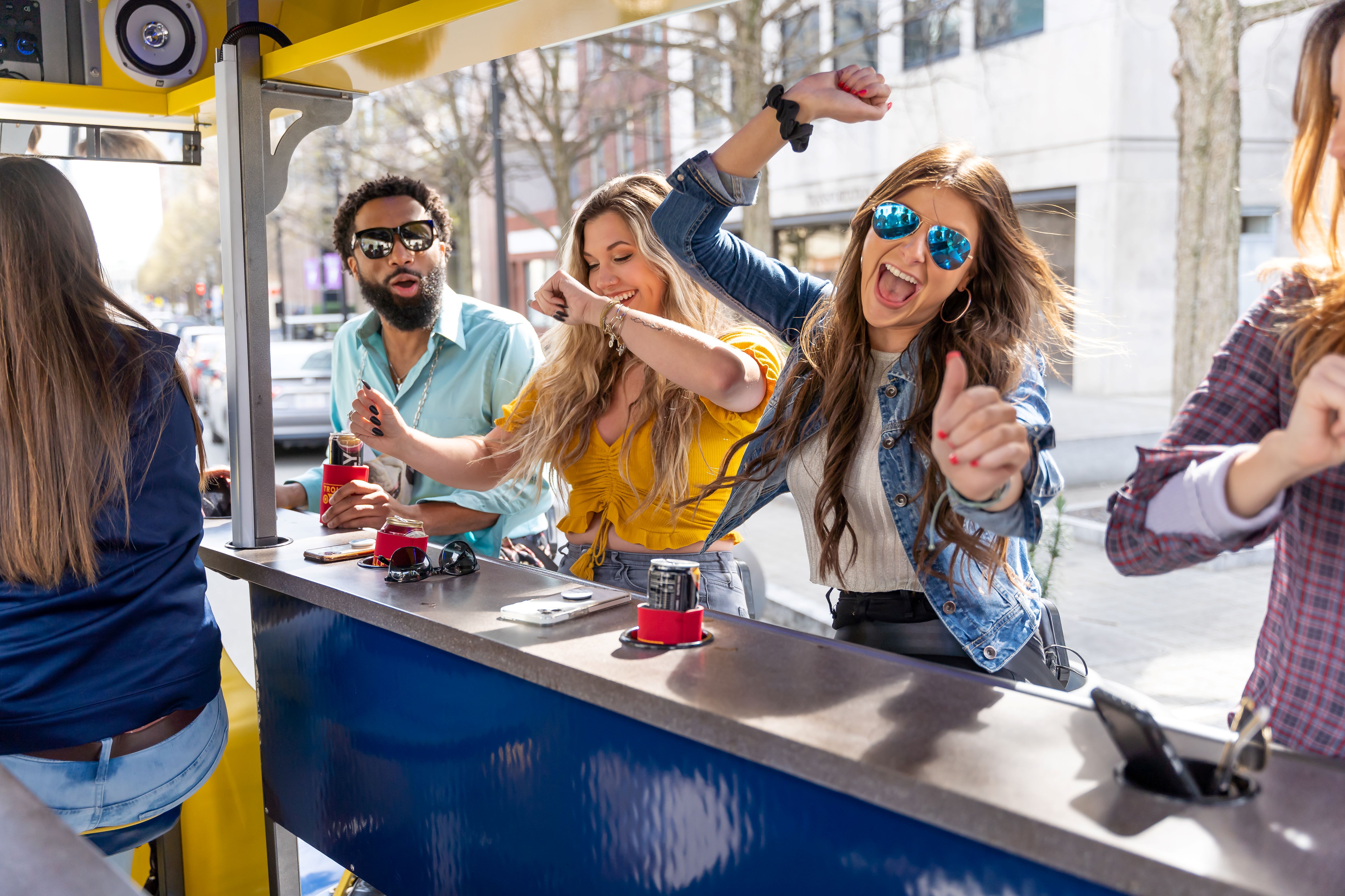 Group having fun on a beer bike pedal pub tour